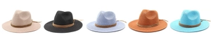Close-up of multicolored straw Panama hats with decorative brown belts and metal buckles