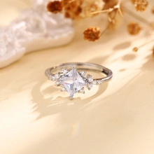 Macro detail of silver adjustable ring with square zircon and small accent stones