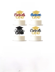 Close-up of paper glitter Congrats GRAD cake toppers for graduation party decoration