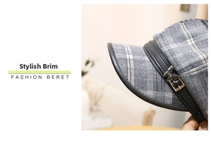 Detail of grey plaid beret with leather brim and golden butterfly metal buckle