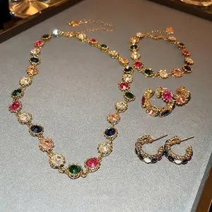 Vintage style colorful gemstone jewelry set with gold metal necklace and bracelet