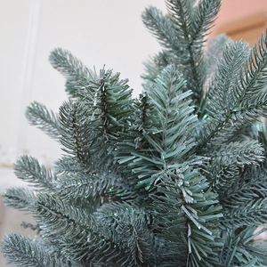 Sparkly frosted mini Christmas tree with dark green pine needles and vintage gold sequins
