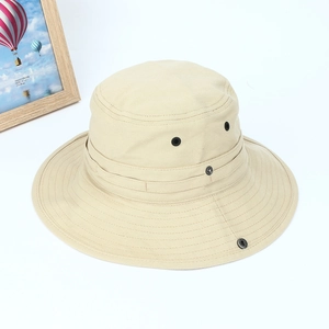 Detail view of khaki sun hat featuring breathable metal eyelets and snap buttons