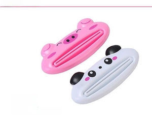 Detail view of cartoon pig and panda tube squeezers made of durable ABS material