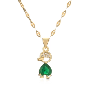 Golden necklace with zircon boy pendant and heart-shaped green gemstone on white background