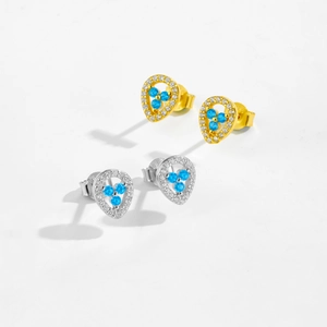 Pairs of minimalist 925 sterling silver stud earrings in gold and silver with blue gems
