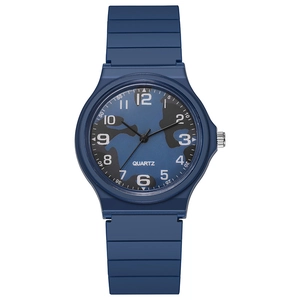 Detail of blue camouflage dial quartz watch with white numbers and silicone strap