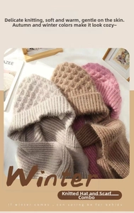 Close-up of knit hooded scarf set in gray, khaki and pink colors with waffle texture