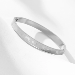 Silver stainless steel bangle bracelet with engraved baby footprint patterns for couples