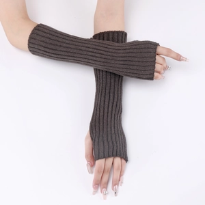 Detailed knit texture of dark brown fingerless arm warmers with thumb hole design