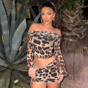 Close-up of leopard print long-sleeve crop top and matching drawstring mini skirt