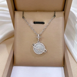 Titanium planet necklace with cat eye stone and sparkling crystals in a jewelry box