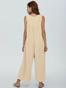 Close-up back view of a beige rib-knit sleeveless wide-leg jumpsuit with pocket detail