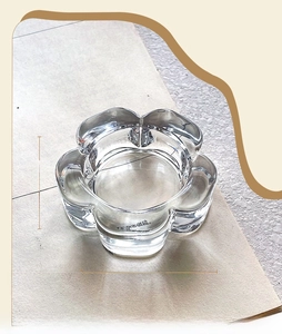 Macro view of plum blossom glass candle holder with 6.5cm diameter and 2cm height