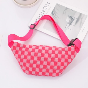 Detail of pink checkerboard knitted waist bag with adjustable strap and buckle