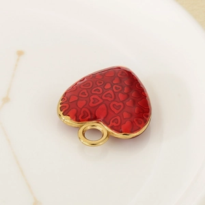 3D red enamel heart pendant necklace with gold metal edges and embossed heart patterns