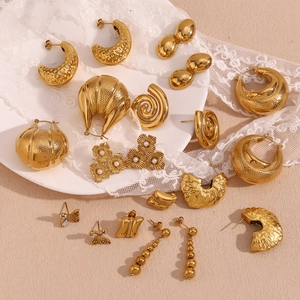Chic 18K gold plated peanut earrings and mixed pearl hoops set on white lace cloth