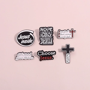 6-piece religious enamel brooch set featuring Jesus motifs and cross designs on pink background