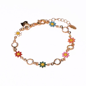 Detail of gold chain bracelet with colorful enamel flowers and clear zircon crystals