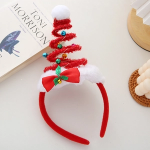 Detail of red plush Christmas headband with bells, spring tree design, and bow decoration
