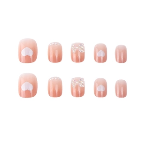 Pink gradient press-on nails with white hearts, pearls and 3D iridescent butterfly bows