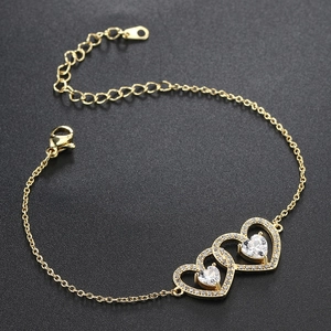 Detail shot of golden interlocking heart bracelet with sparkling pavé cubic zirconia