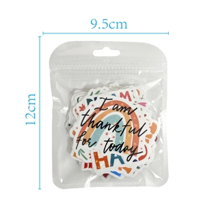 Close-up of holographic stickers in a transparent zip bag with motivational rainbow theme