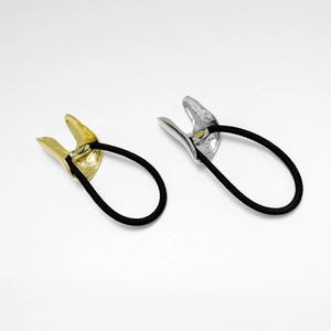 Minimalist elastic hair ties with gold and silver horseshoe metal buckles on white background