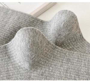 Macro shot of grey ribbed socks showing high-quality knitted texture and reinforced heel