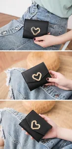 Detailed close-up of a black heart-shaped buckle wallet shown from multiple angles