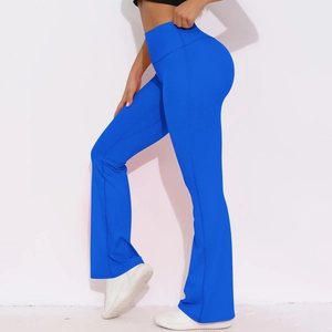 Detail of high waisted royal blue flared yoga pants showing ergonomic fit and slit hem