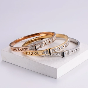 Three-color hollow Roman numeral bracelets with pavé diamonds in rose gold, gold and silver