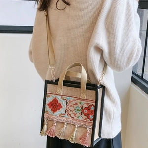 Ethnic embroidered canvas tote bag with tassels and adjustable strap for women