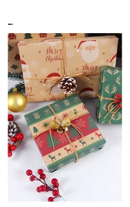Detailed macro of vintage Kraft Christmas wrapping paper with festive reindeer and snowflake patterns