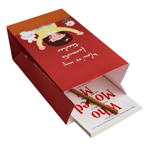 Red cartoon paper gift bag with 'You're my favourite teacher' text for Teacher's Day