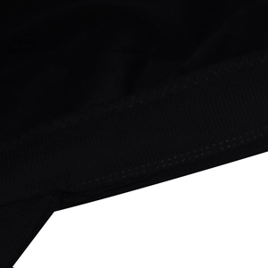 Macro detail of breathable black mesh fabric and reinforced zigzag stitching on the cap