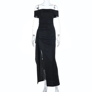 Detail of elegant black off-shoulder maxi dress with side slit and shimmering fabric