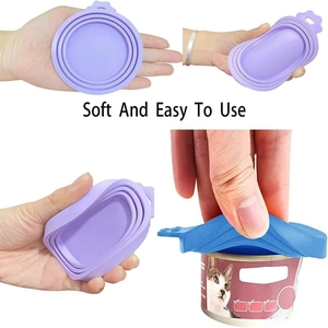 Close-up of flexible silicone pet can covers in purple and blue showing soft texture