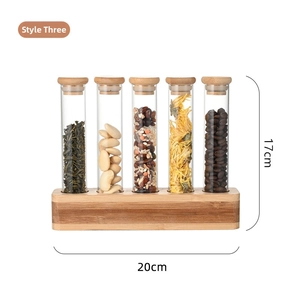 Detailed view of 5-tube glass storage set with wooden stoppers on a wooden display stand