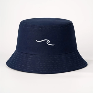 Detail of navy blue cotton bucket hat featuring white wave embroidery on a clean white background
