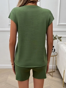 Rear view of green two-piece casual set featuring a sleeveless top and comfortable shorts