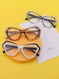 Close-up of cat-eye eyewear frames in leopard, tortoise, and monochrome floral patterns