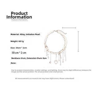 Detail view showing multi-layer star and heart pendants with pearl chain measurements