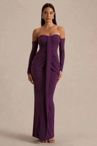 Detail view of deep purple ruched dress featuring elegant pleats and decorative streamers