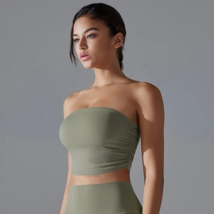 Detail of sage green tube top with side ruching and breathable stretch fabric