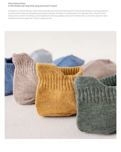 Detail of ribbed knit cuffs on low-cut cotton socks in earthy solid colors