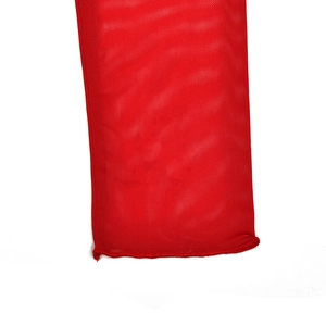 Macro shot of red mesh fabric texture and stitching details on a long sleeve dress