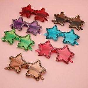Colorful star-shaped rimless sunglasses with hand-set rhinestones in multiple candy colors