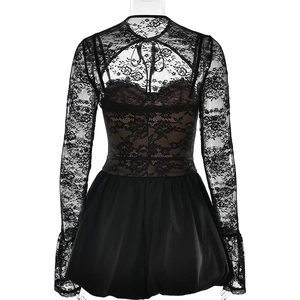 Detail of elegant black lace long sleeve top and matching shorts on a model