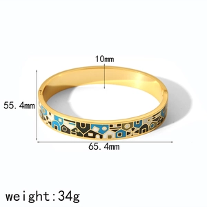 Detail view of 10mm gold enamel bangle showing 55.4mm and 65.4mm size specifications